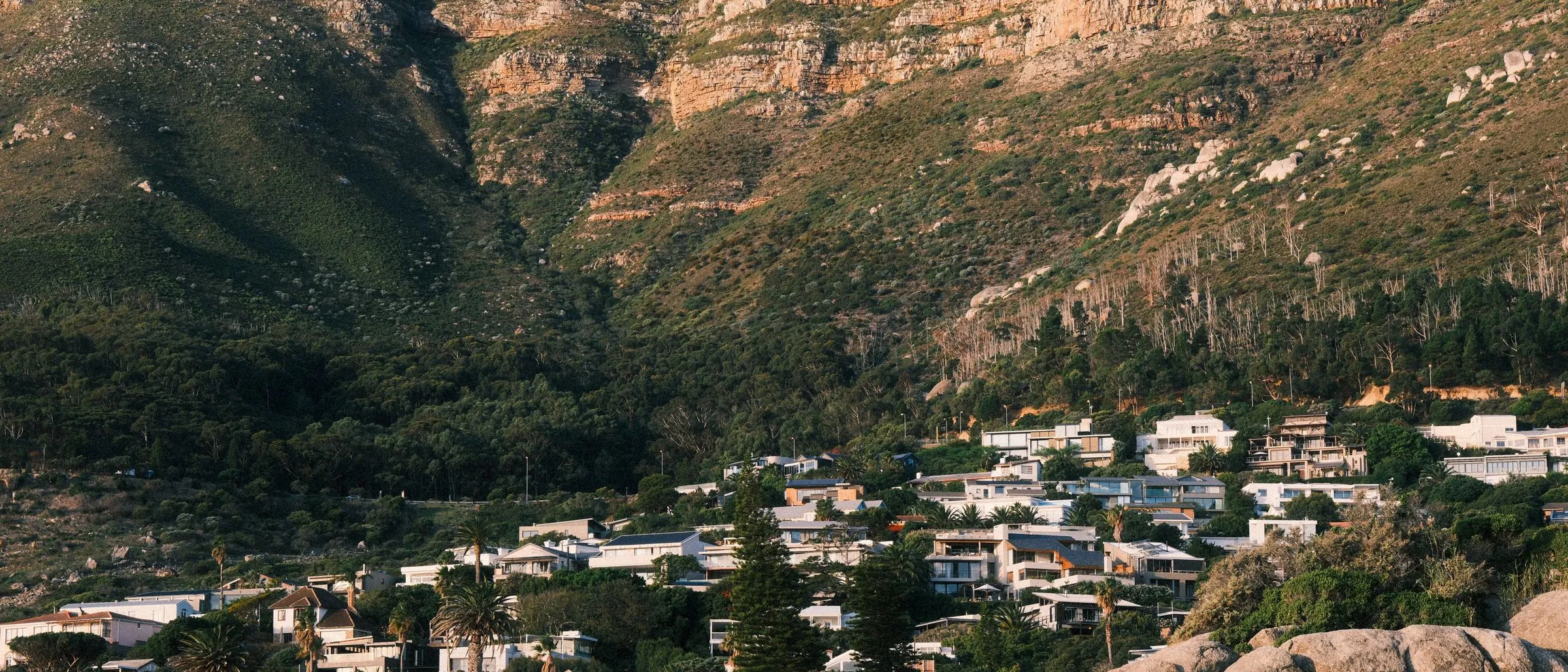 Homes on the slopes below the mountains near Cape Town.