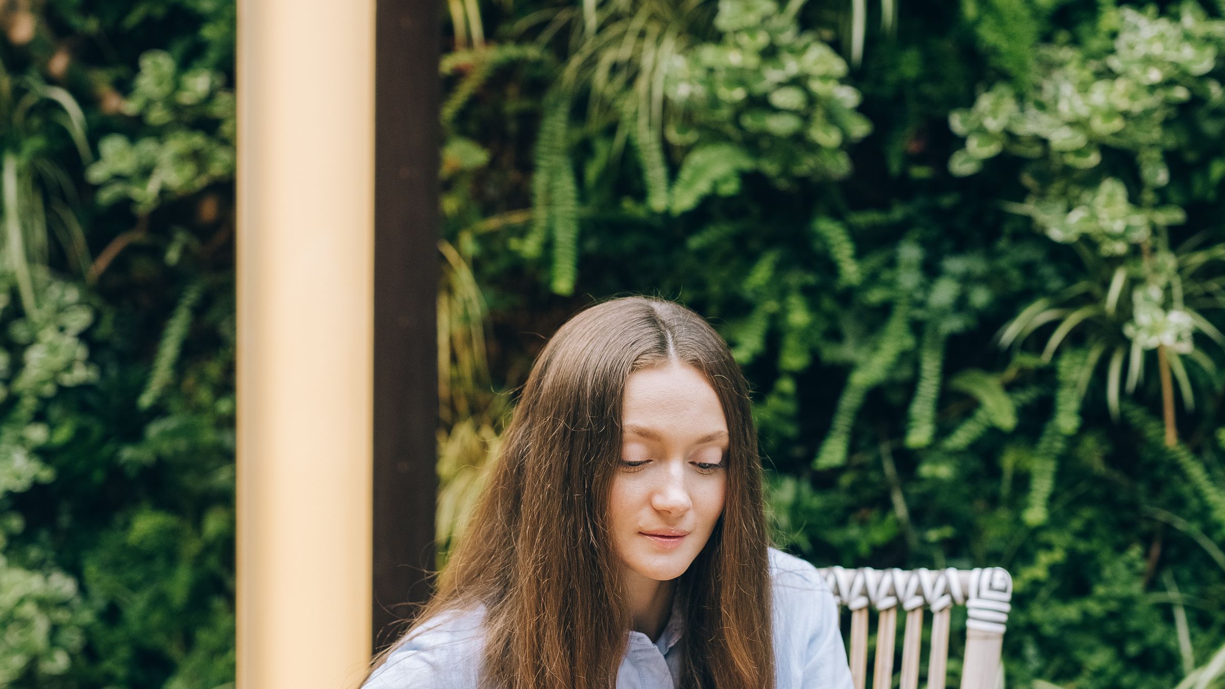 Young woman using her phone outdoors