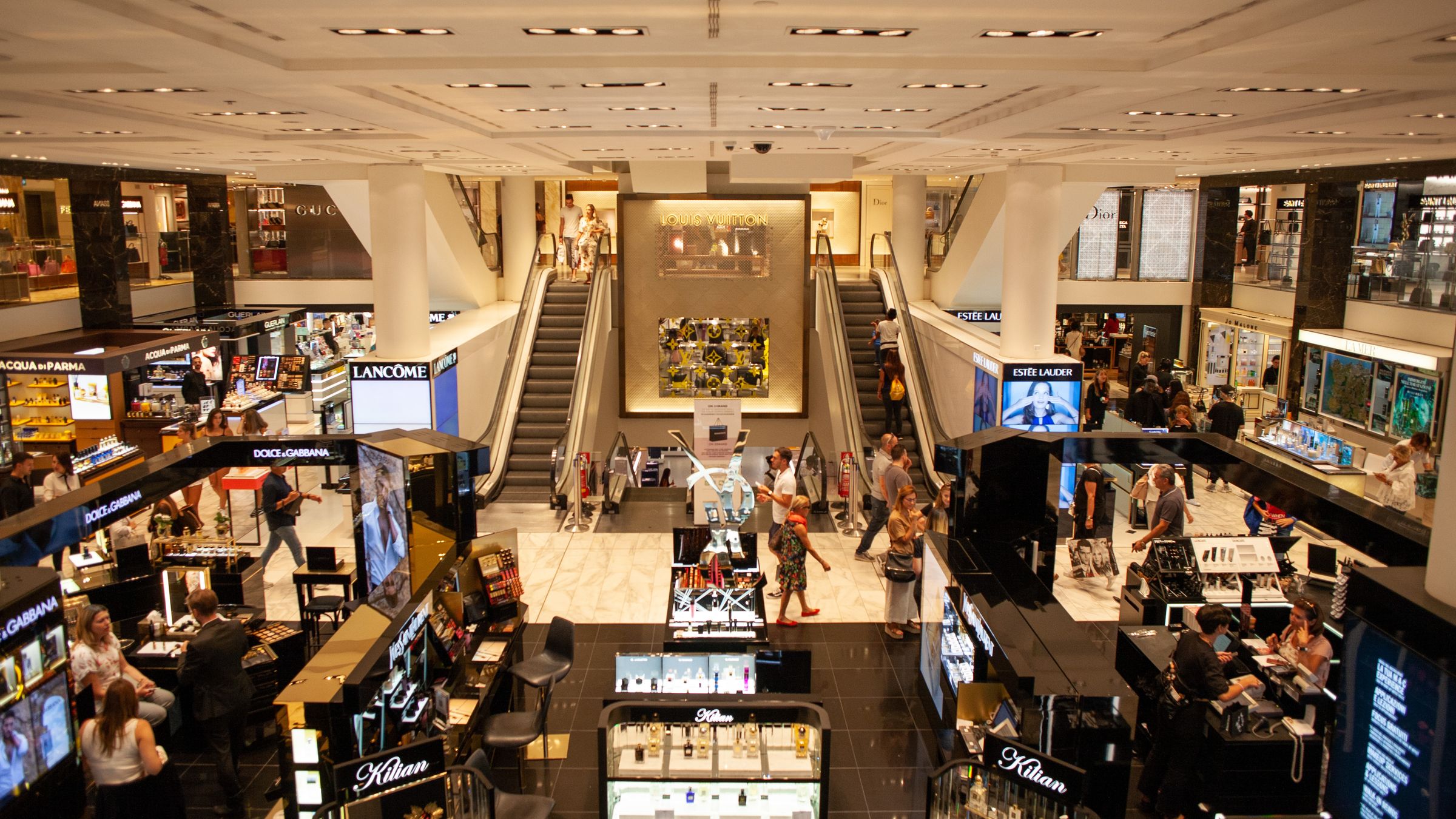 Shoppers inside a busy shopping mall