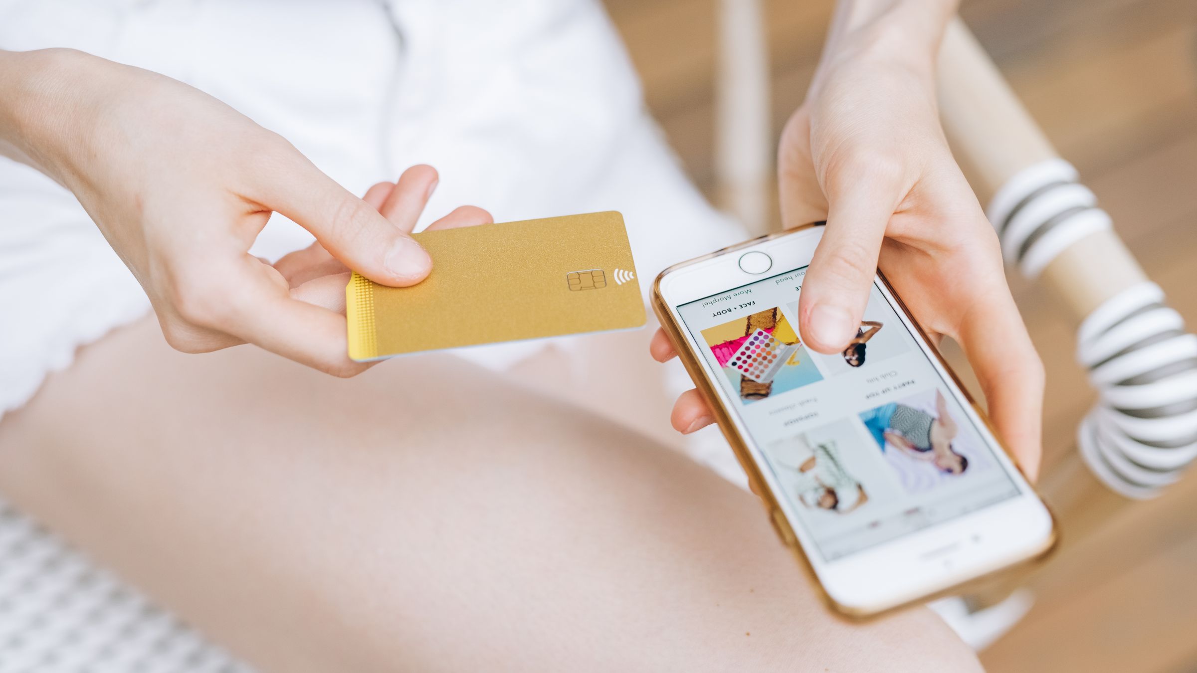 Shopper paying for an order on a phone with a bank card